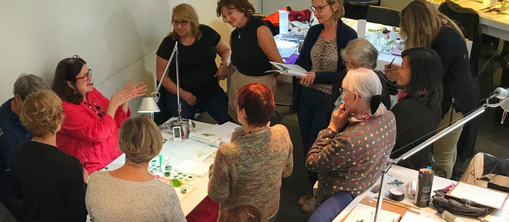 Margaret Best conducting an in-person botanical art workshop in France. 